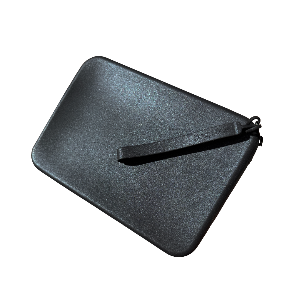 designed for adventure, bold and shiny black onyx clutch bag with handle for e-readers like kindle and kobo, ready for handheld device safely in place 